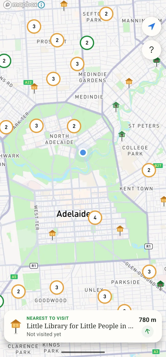 A zoomed-out map of Adelaide with libraries grouped into circles: amber where some haven't been visited, green where they all have